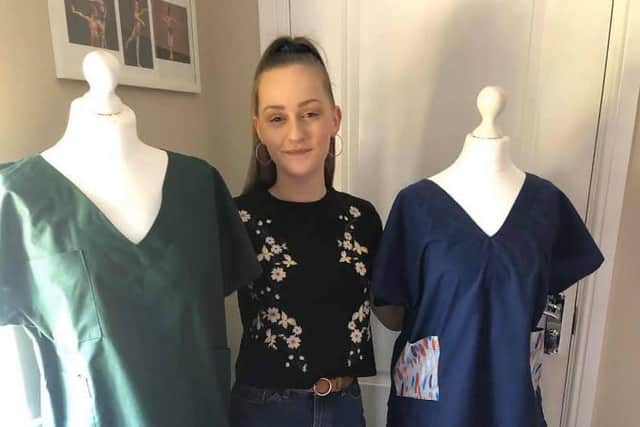 Year 13 pupil Megan Swales with the scrubs she has made