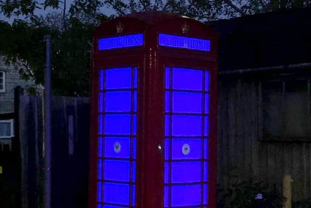 The phone box in Upton which was lit up blue to thank the NHS