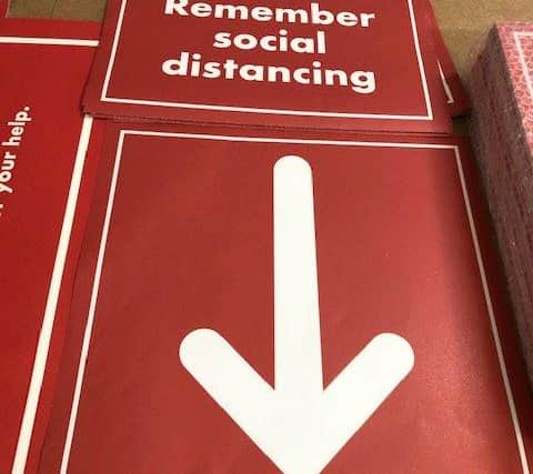 Social distancing signs created by Fisherprint.