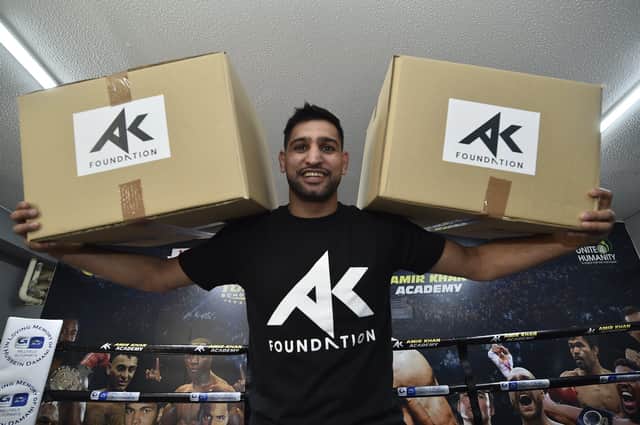 Amir Khan at Topyard Boxing Club, Cromwell Road helping to hand out food for the homeless and needy. EMN-200521-161520009