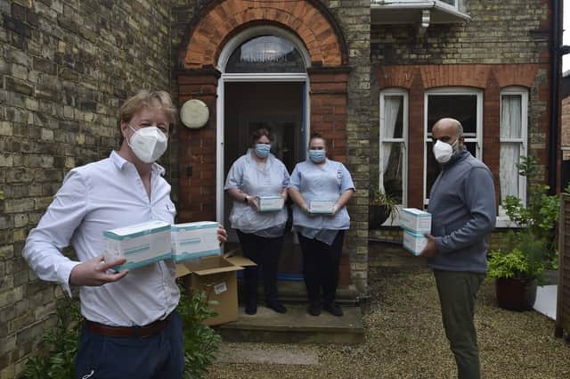 Philia Lodge residential home at Eastfield Road. Paul Bristow MP with Ishfag Hussain handing over PPE masks. EMN-200427-140104009