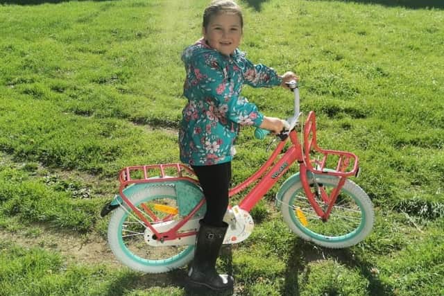 Millie Bayford on a bike ride to raise money for the NHS