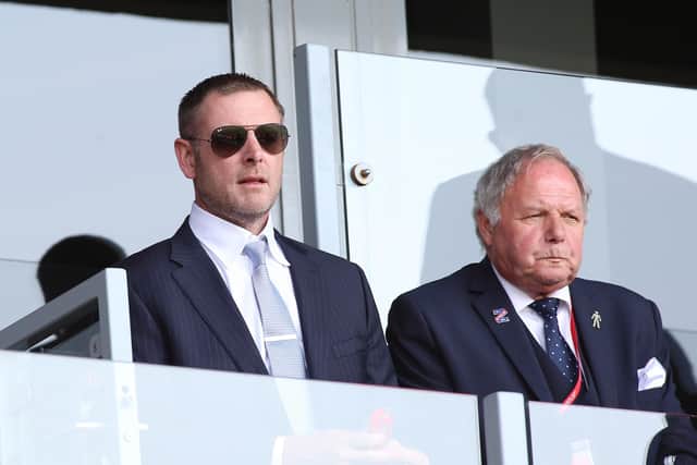 Posh chairman Darragh MacAnthony (left) and director of football Barry Fry have to wait another week before learning their club's fate.