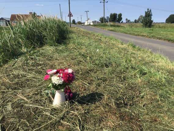 Flowers at the scene of the crash
