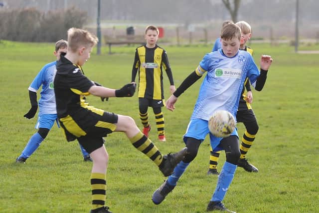 Crowland Juniors (yellow) in action.