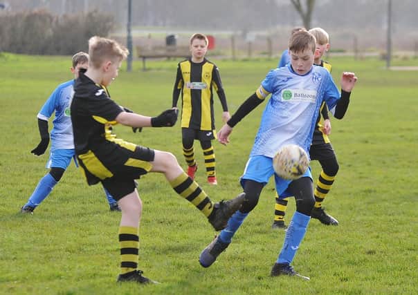 Crowland Juniors (yellow) in action.