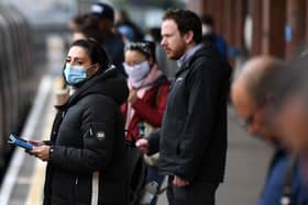 Don't forget to wear your mask on trains and in stations from Monday (Photo by DANIEL LEAL-OLIVAS/AFP via Getty Images)