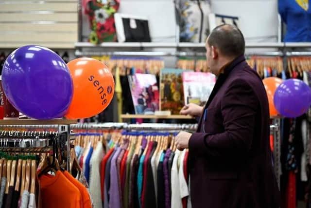 Staff at the Sense charity shop prepare for reopening