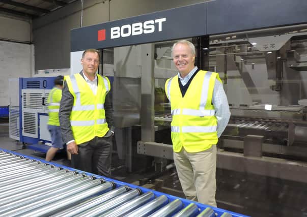 BOBST machine installed at Manor Packaging Whittlesey with Director Tony Clifton (left) and MD David Orr (right).