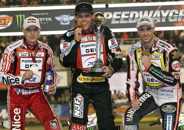 Niels-Kristian Iversen, right, joins Jarek Hampel, left, and Tai Woffinden on the final 2013 Grand Prix series podium. Photo: Jarek Pabijan & ToInspire.