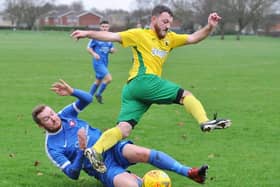 Crowland Town (yellow) in action.