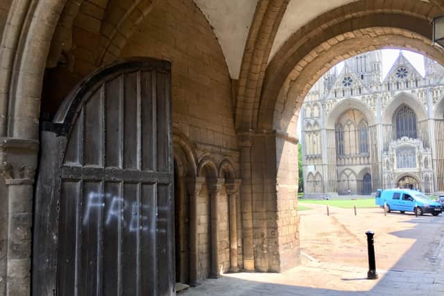 Graffiti has been sprayed on the historic gates
