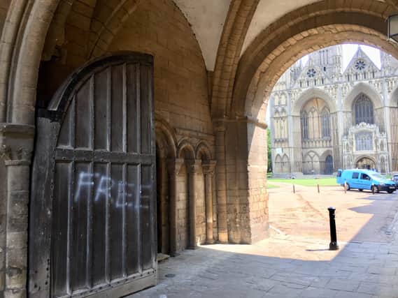 Graffiti has been sprayed on the historic gates