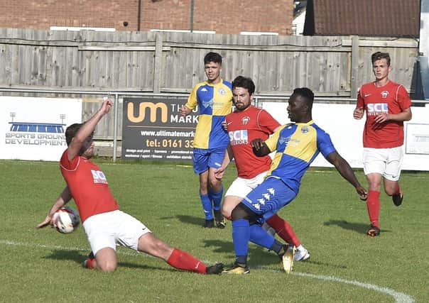 Action from Peterborough North End v Downham (red). Photo: David Lowndes.