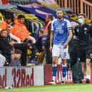Mark Beevers limps off towards the end of the game against Cardiff City. Photo: Joe Dent/theposh.com.