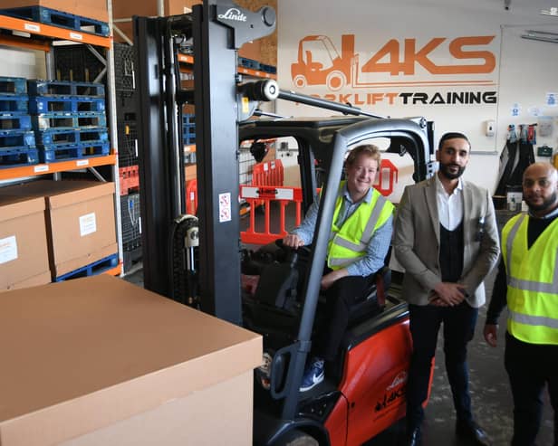 Peterborough MP Paul Bristow at forklift training company 4KS with directors Sheikh Miah and Zahid Ali. EMN-211110-144809009