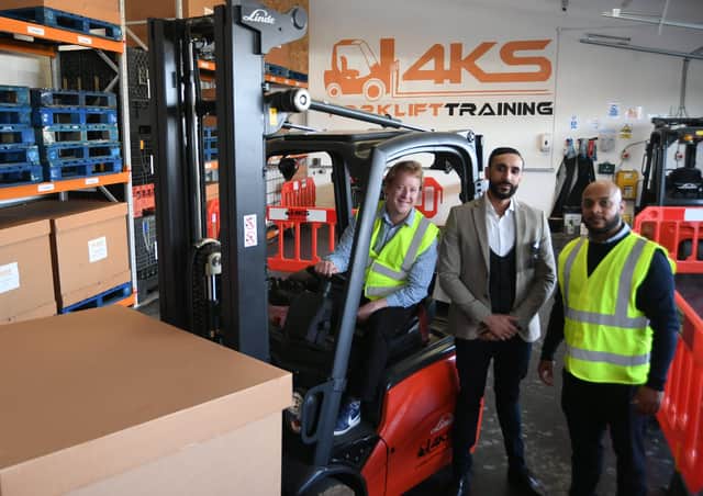 Peterborough MP Paul Bristow at forklift training company 4KS with directors Sheikh Miah and Zahid Ali. EMN-211110-144809009