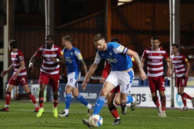 Posh skipper Mark Beevers in action.