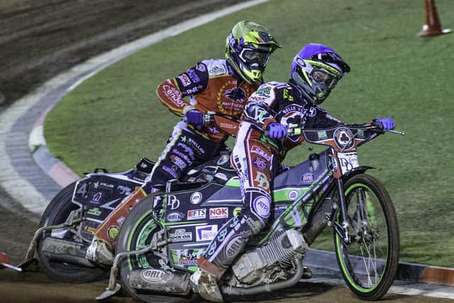 Charles Wright of Belle Vue holds off Scott Nicholls of Peterborough Panthers. Photo: Ian Charles/MI News.