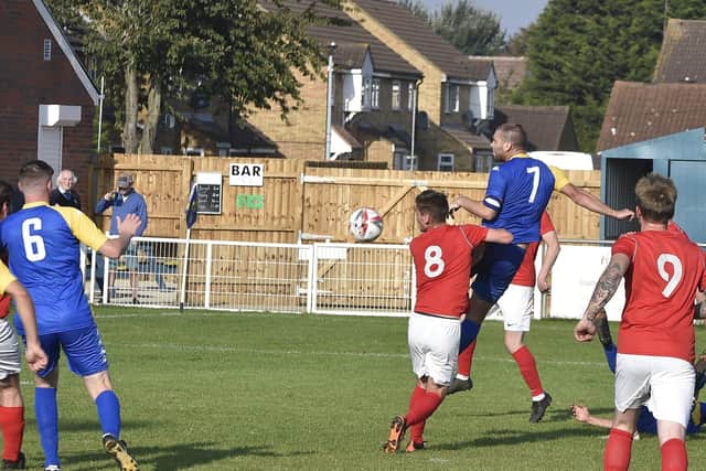 Action from Peterborough North End's 2-2 draw with Downham (red) at the Bee Arena. Photo: David Lowndes.