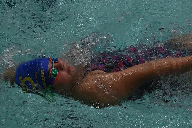 Lilian Marakovachev swimming for COPS in the  50m backstroke at the Regional Pool.
