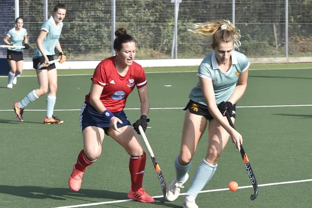 Action from a 3-2 win for City of Peterborough Ladies (red) over Cambridge University at Bretton Gate.  Photo: David Lowndes.