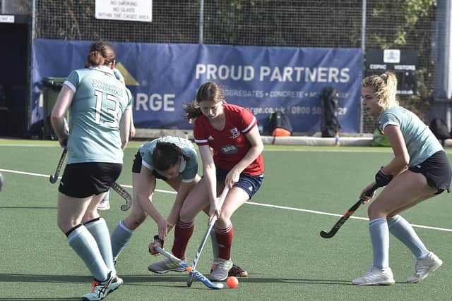 Action from City of Peterborough Ladies (red) v Cambridge University. Photo: David Lowndes.