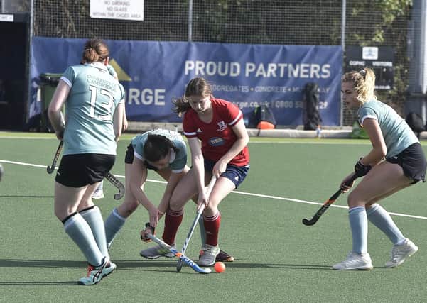 Action from City of Peterborough Ladies (red) v Cambridge University. Photo: David Lowndes.