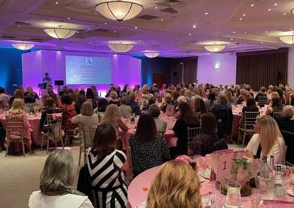 Around 250 ladies listen to Breastcare Nurse Specialist Claire Hall at the
annual fund-raising lunch.