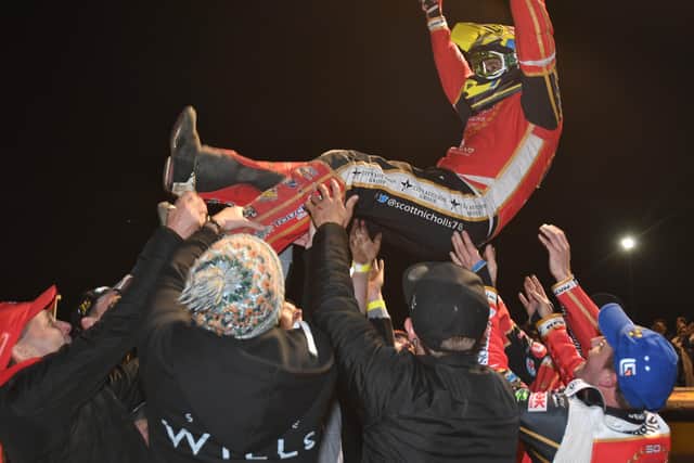 Panthers skipper Scott Nicholls receives the bumps after sealing the Grand Final win in Heat 14. Photo: David Lowndes.