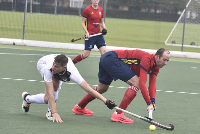 Paul Hillsdon (red) in action for City of Peterborough against Loughborough Students. Photo: David Lowndes.