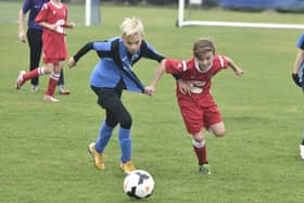 Action from Whittlesey (blue) v Stamford in Under 12 Division Two. Photo: David Lowndes.