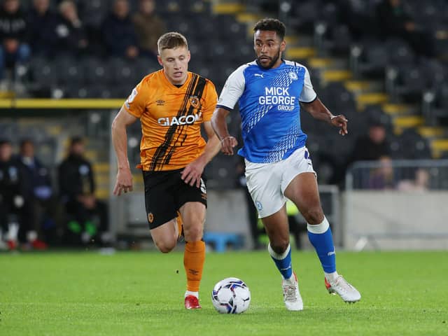Nathan Thompson of Peterborough United in action with Greg Docherty of Hull City. Photo: Joe Dent/theposh.com.