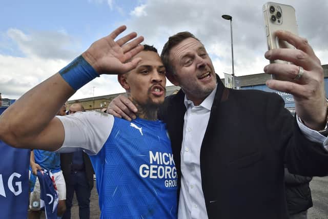 Darragh MacAnthony with Jonson Clarke-Harris after promotion to League One last season.