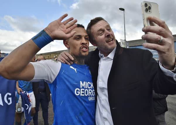 Darragh MacAnthony with Jonson Clarke-Harris after promotion to League One last season.