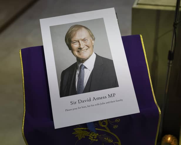 A photograph of Sir David Amess is displayed during a vigil held at Saint Peter's Catholic Church in Leigh-on-Sea. (Photo by Dan Kitwood/Getty Images)