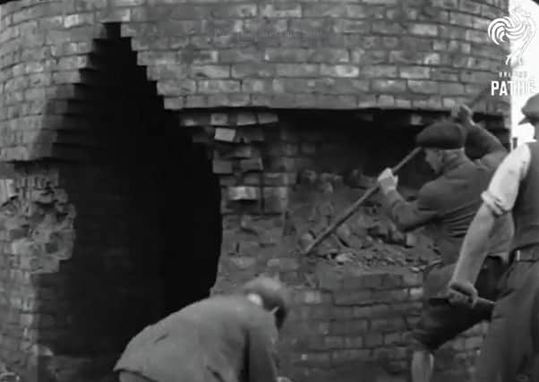 The chimney being prepared for demolition in Peterborough in 1926. Picture taken from British Pathe footage.