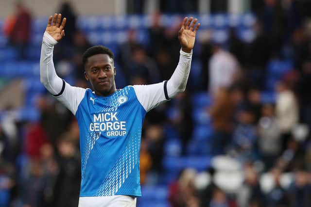 Siriki Dembele of Peterborough United celebrates victory over QPR at full-time. Photo: Joe Dent/theposh.com.