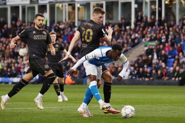 Siriki Dembele of Peterborough United scores the winning goal against Queens Park Rangers. Photo: Joe Dent/theposh.com.