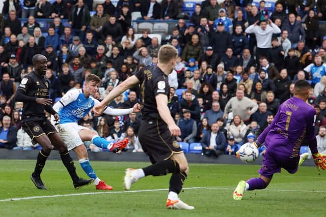 Harrison Burrows of Peterborough United scores his sides equalising goal against Queens Park Rangers. Photo: Joe Dent/theposh.com.