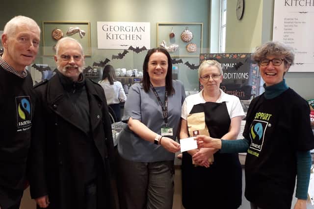 Kerry Green (Cafe Manager at Peterborough Museum) receiving her Fairtrade cafe status from Peterborough Fairtrade City Steering group.
