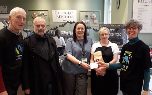 Kerry Green (Cafe Manager at Peterborough Museum) receiving her Fairtrade cafe status from Peterborough Fairtrade City Steering group.