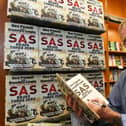 Des Powell signing copies of SAS Bravo Three Zero at Waterstones Book Shop, Bridge Street. EMN-211030-133814009