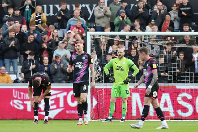David Cornell of Peterborough United cuts a dejected figure after Swansea City score their second goal of the game. Photo: Joe Dent/theposh.com