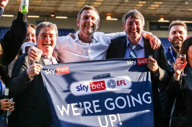 Posh co-owners, from left, Stewart Thompson, Darragh MacAnthony and Dr Jason Neale celebrate promotion from League One last season.