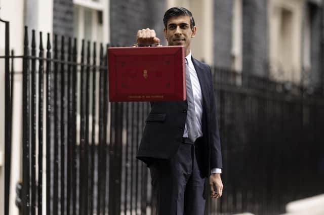Chancellor of the Exchequer, Rishi Sunak holds the budget box . (Photo by Dan Kitwood/Getty Images)