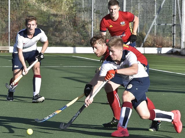 Action from City of Peterborough (red) v Olton & West Warwicks. Photo: David Lowndes.