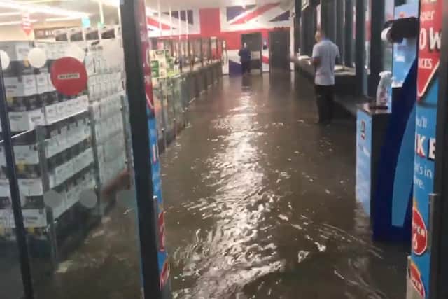 Flood waters inside Aldi at PE1 Retail Park near Eye.