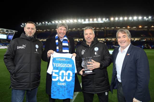 The co-owners made a presentation to Darren Ferguson to mark his 500th game as Posh manager on Tuesday night. Pictured are, from left, Darragh MacAnthony, Dr Jason Neale, Ferguson and Stewart 'Randy' Thompson. Photo: Joe Dent/theposh.com.