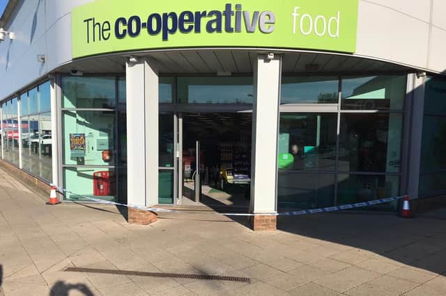 Police tape outside the Co-op in Orton Goldhay. Photo: Stephen Briggs.